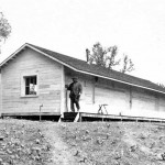 Swami-Trigunatita-on-the-porch-of-his-cabin-1910-150x150